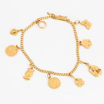 18K gold bracelet with charms.