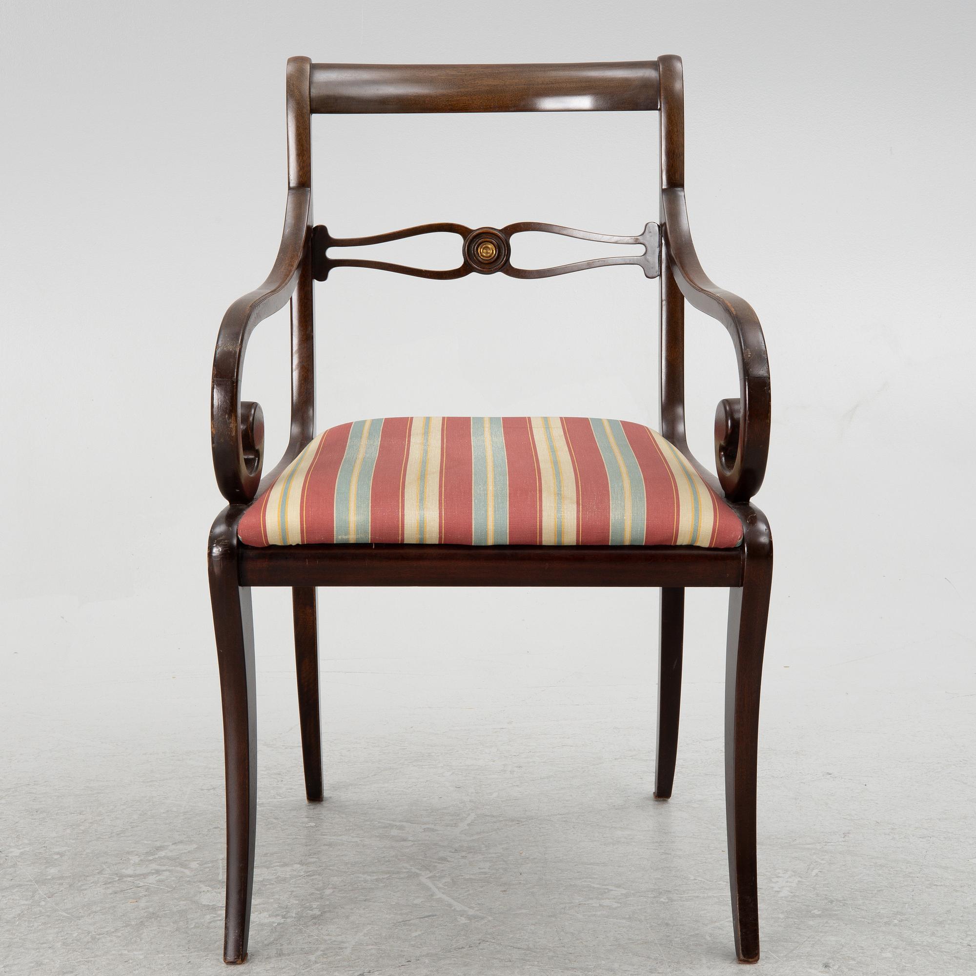 A mahogany veneer desk with desk chair, 20th Century.