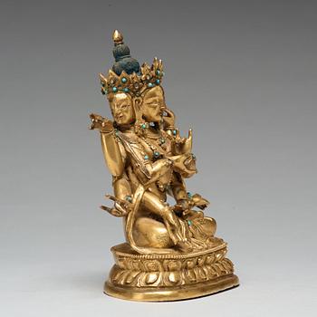 A Sino-Tibetan gilt copper alloy figure of Ushnisha Vinaya, late 18th century/circa 1800.