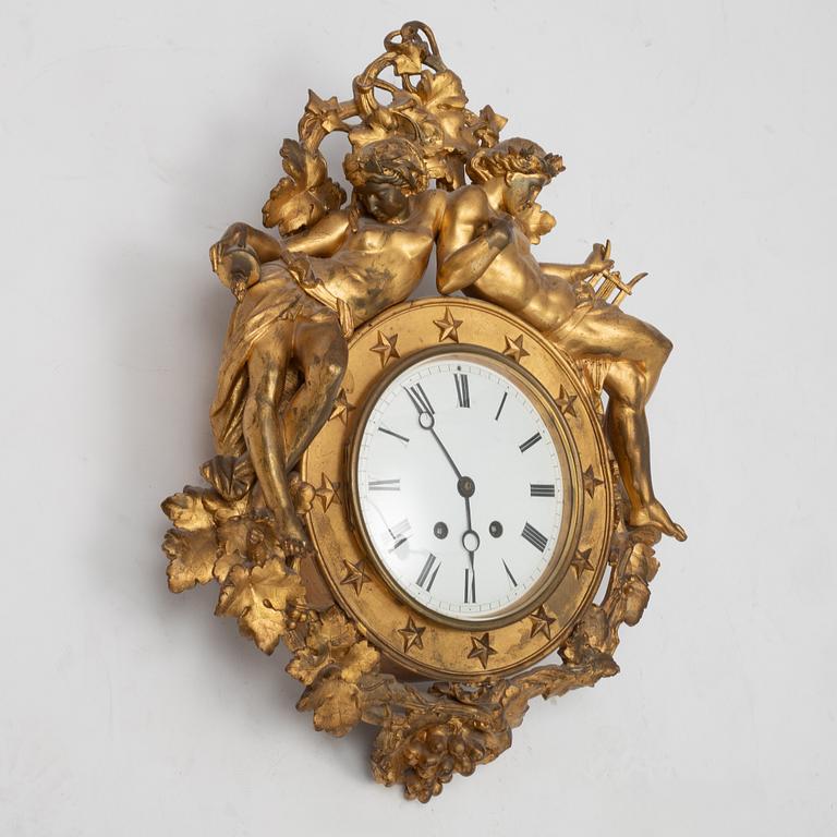 An Empire wall clock, 19th Century.