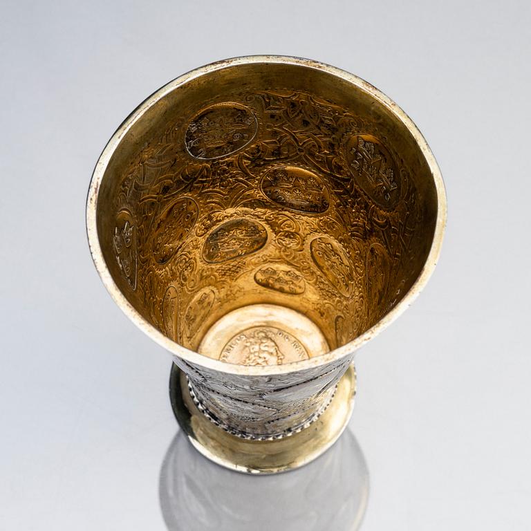 A Polish 18th century parcel-gilt silver coin beaker, mark of Benjamin Berent, Danzig (active 1713-1756).