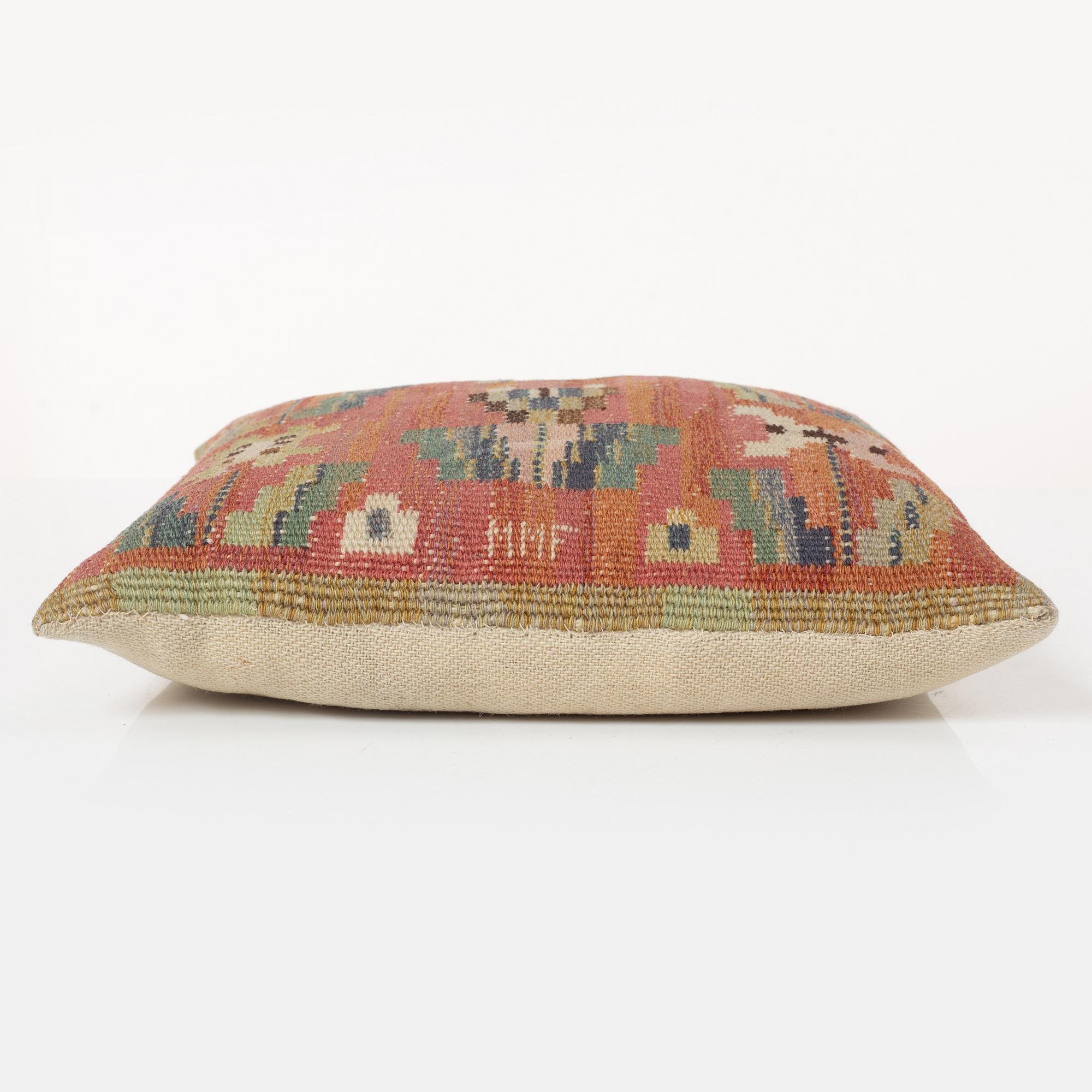 Märta Måås-Fjetterström, a cushion, 'Blommor på röd botten', signed MMF, c. 32 x 32 cm.