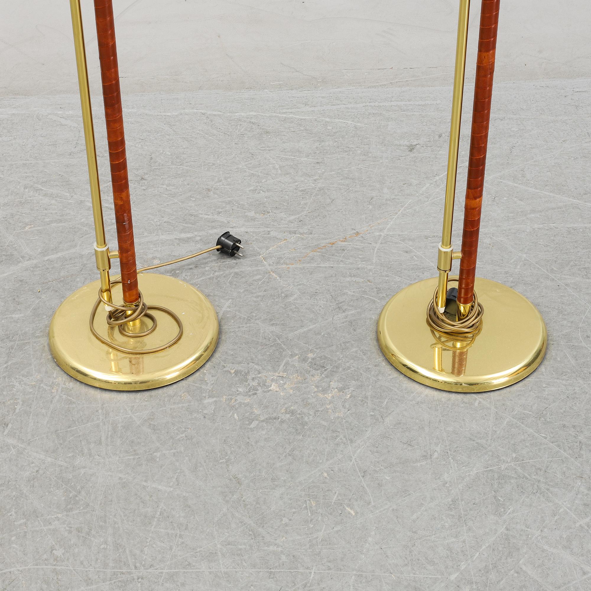 A pair of brass and leather floor lamps, Örsjö Designe, 21st century.