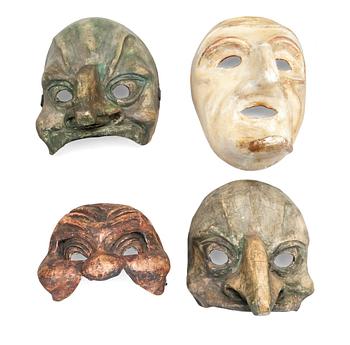 A SET OF FOUR THEATRE MASKS,