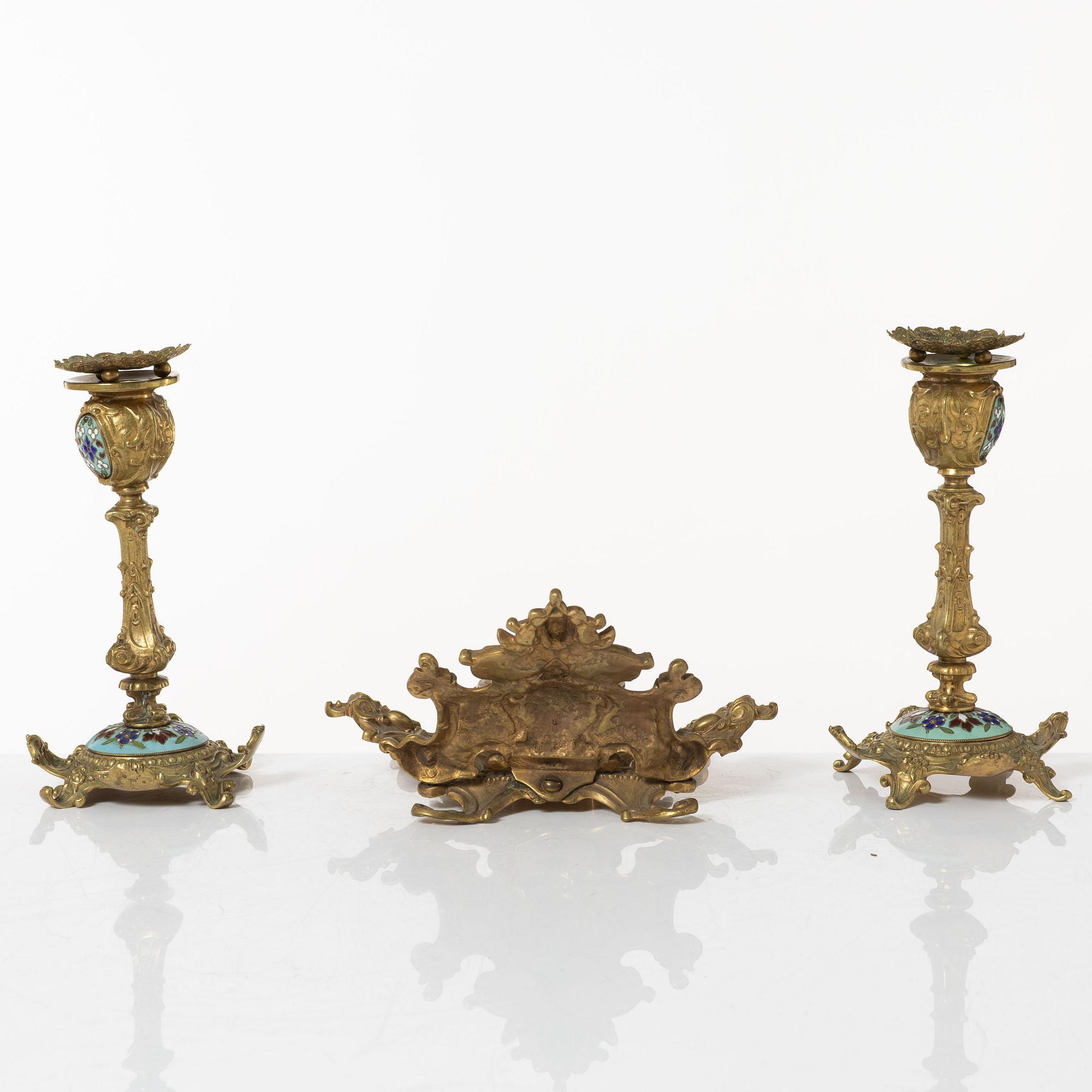 A pair candlesticks and an inkwell, circa 1900.