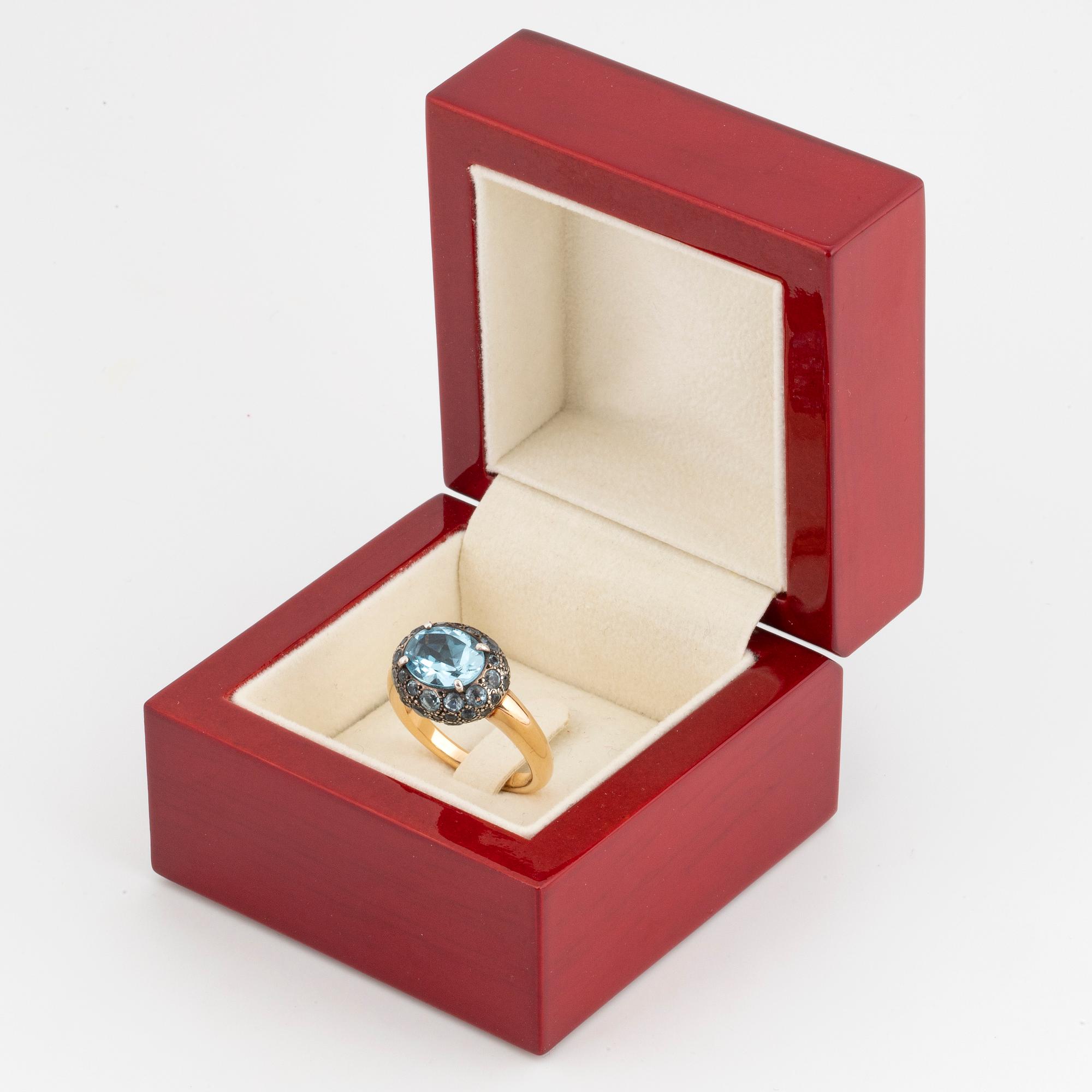 Pomellato ' Tabou' ring, 18K gold and silver with blue topazes.