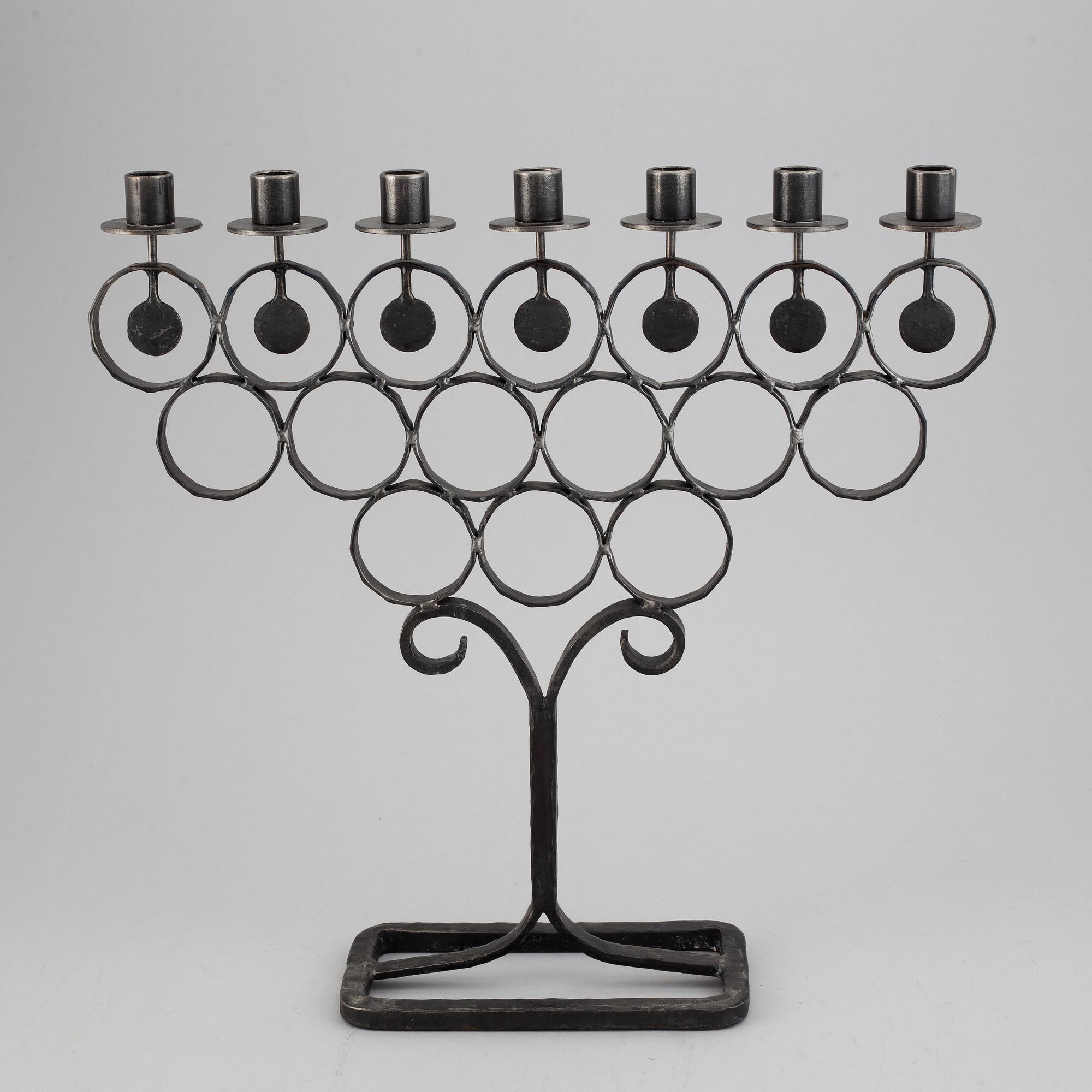 A cast iron candelabra by Bertil Vallien for Kosta Smide, Sweden.