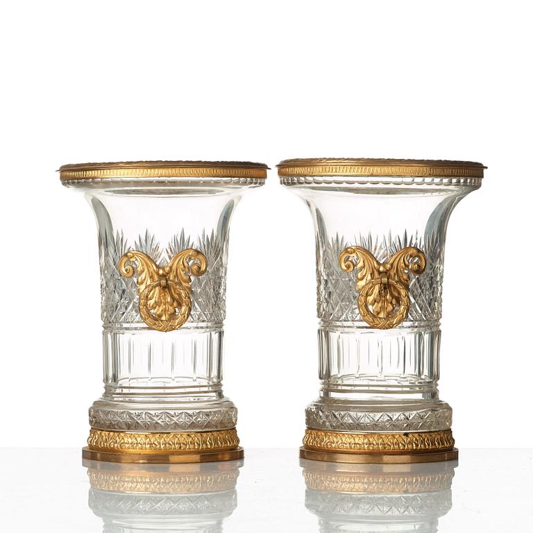 A pair of Empire-style circa 1900 cut glass and gilt-brass urns.