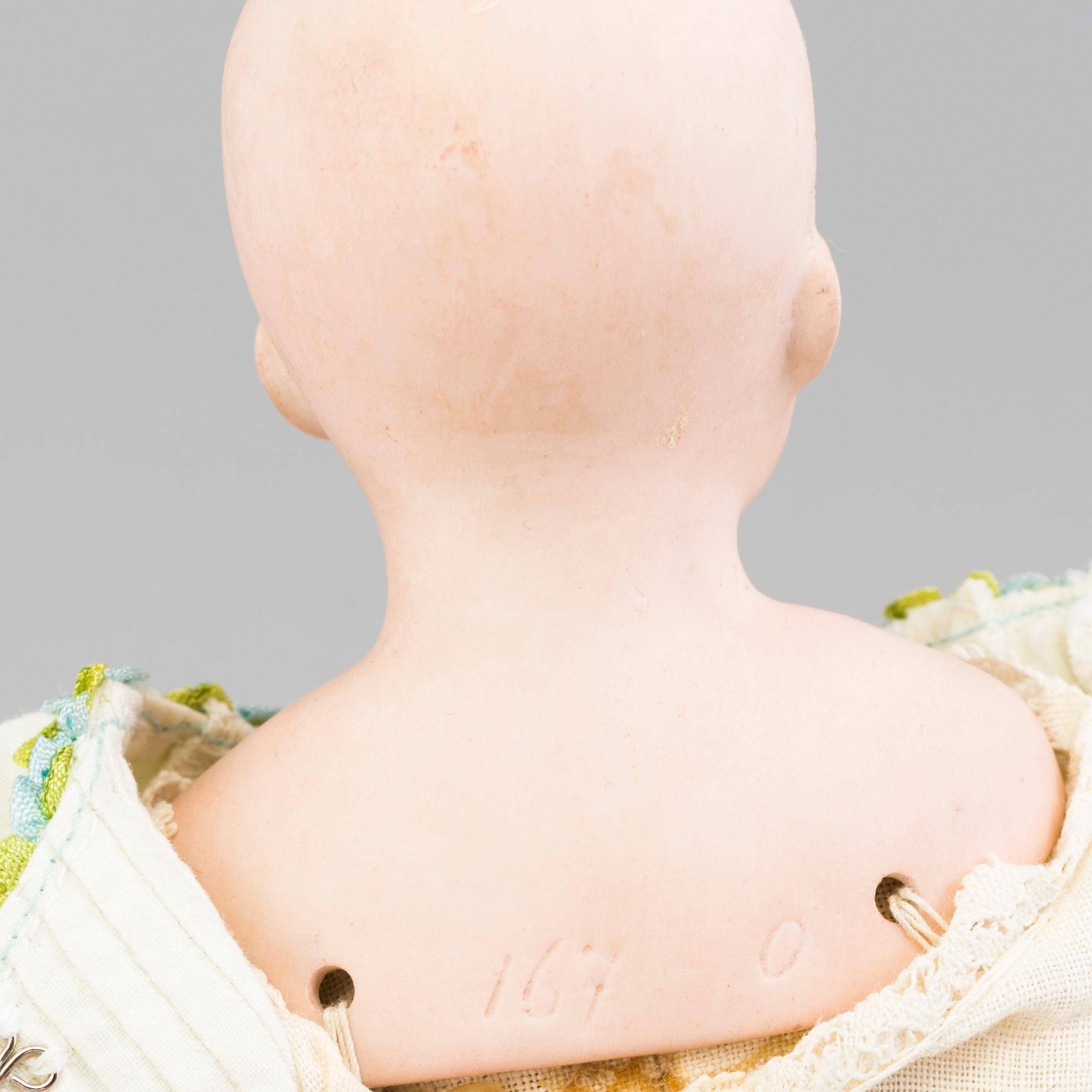 a German porcelain doll from the early 20th century.