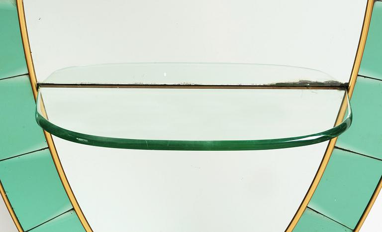 Italian designer, a wall mirror, 1950-60's. Emerald green tinted glass and brass frame.