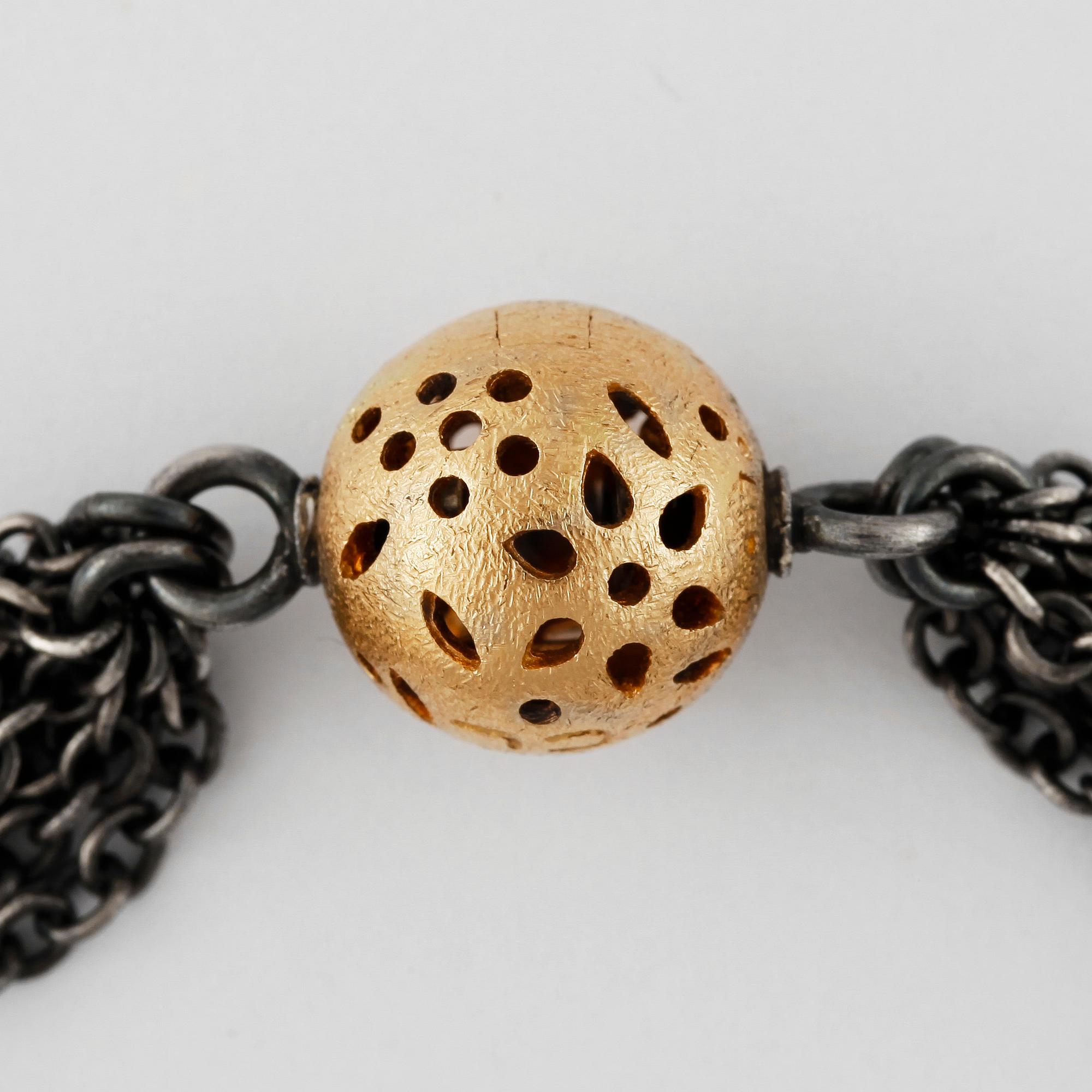 ARMBAND, Ole Lynggaard, oxiderat sterlingsilver och 18k guld och briljantslipade diamanter, lås "Blonde" i 18k guld.