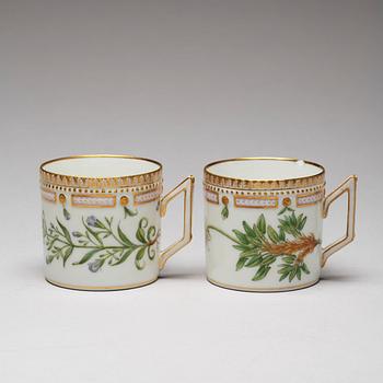 A pair of Royal Copenhagen "Flora Danica" coffee cups with stands, Denmark, 20th Century.