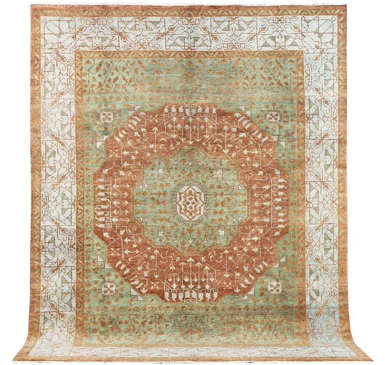An oriental carpet with Mamluk design, c. 358 x 281 cm.