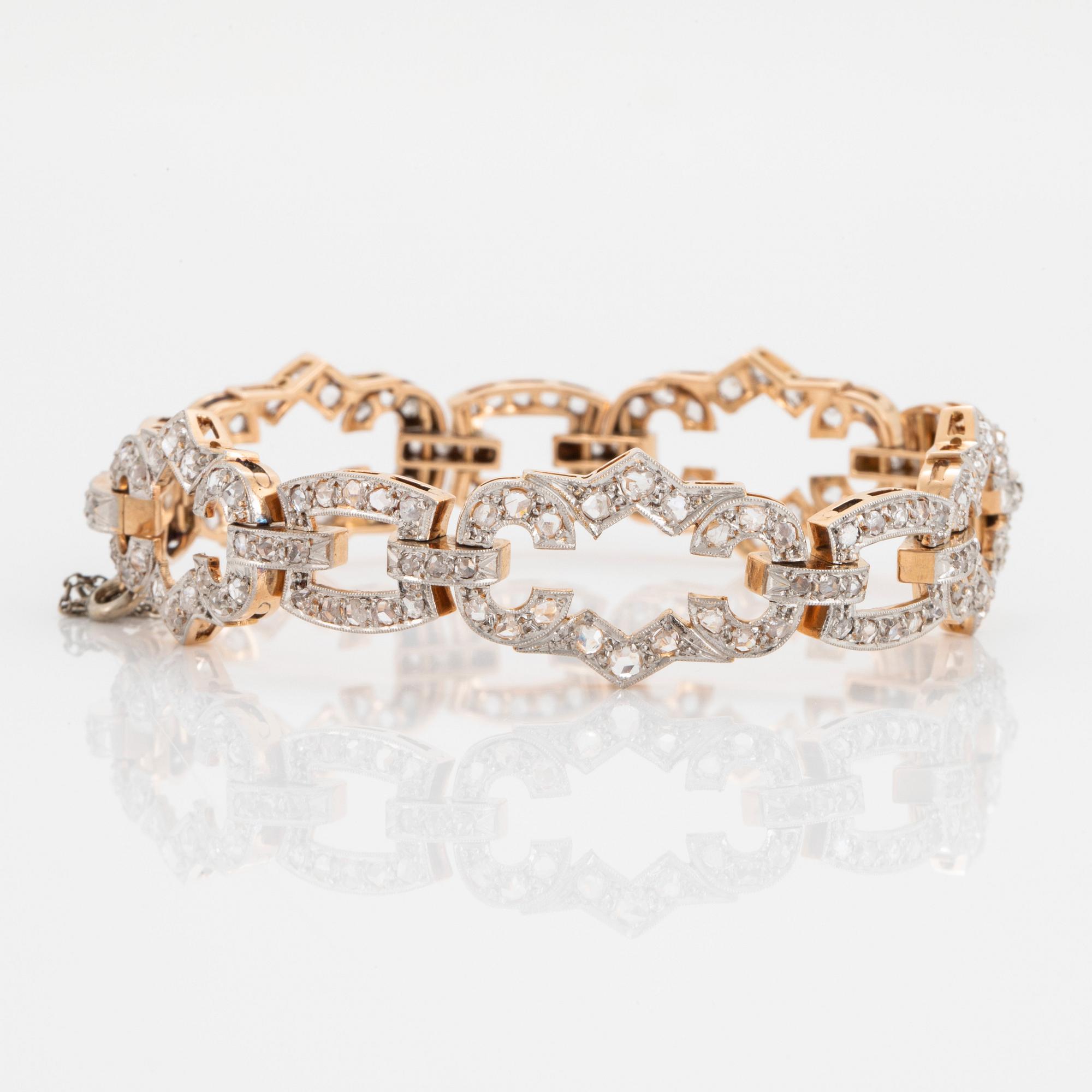 A 14K gold and platinum bracelet set with rose-cut diamonds.