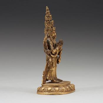 A standing figure of a 11-head Avalokiteshvara with eight arms, Tibet, circa 1800.