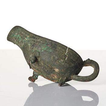 A Chinese brushpot, Qing dynasty, circa 1900. An archaistic bronze ewer and a silvered South East Asian bowl with stand.