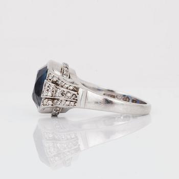 A circa 11.00 ct sapphire and single-cut diamond ring. Total carat weight of diamonds circa 0.40 ct.