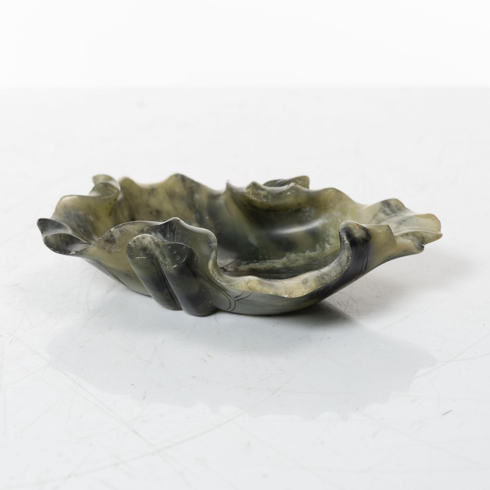 A Chinese green stone brush washer, a carved bone and a soapstone figure, partly Qing dynasty.