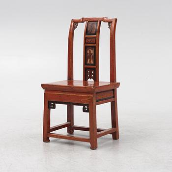 A red-lacquered chair, China, Qingdyansty, late 19th century.