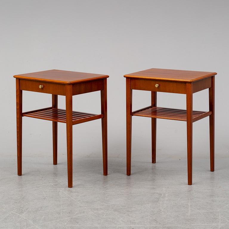 a pair of mahogany bedside tables.