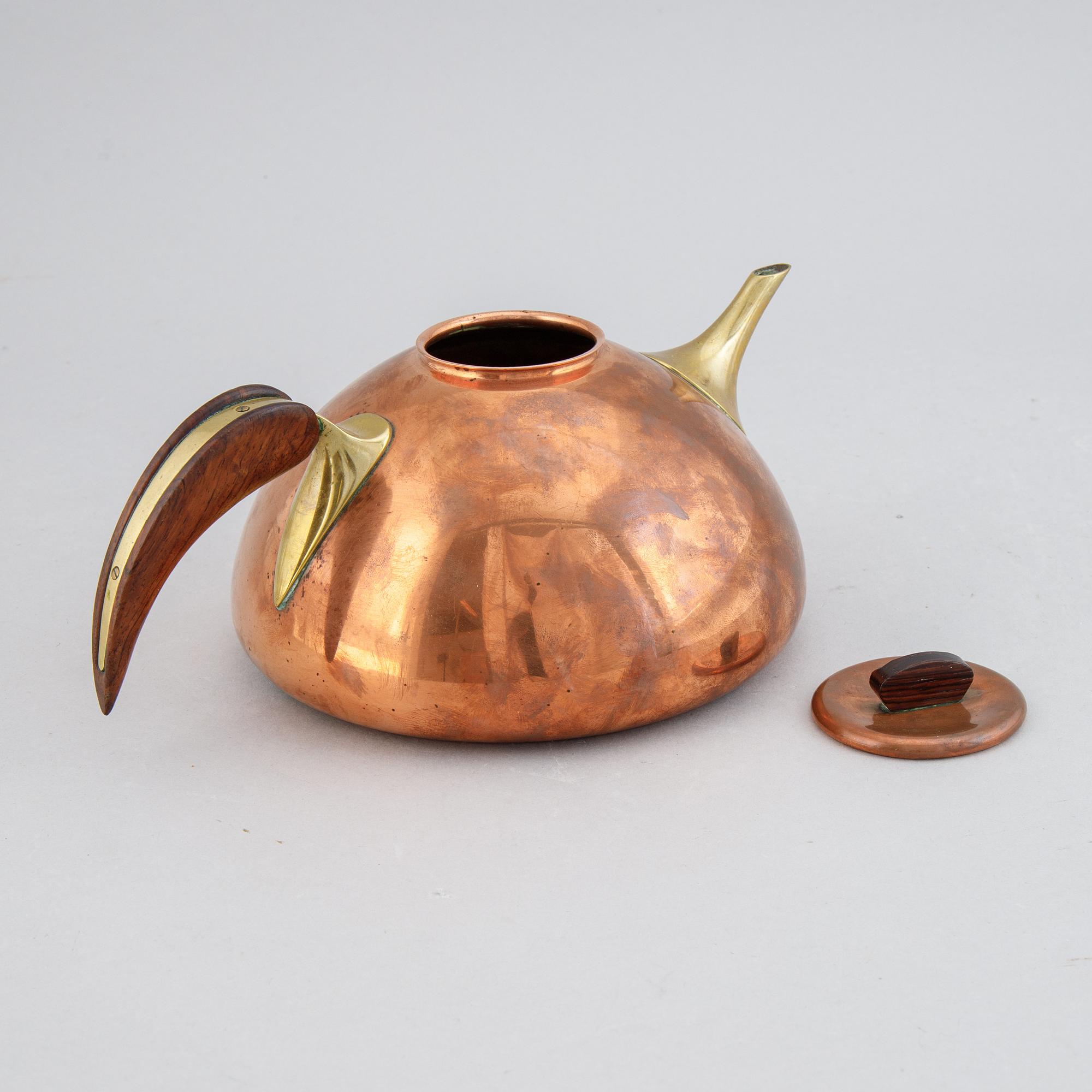 A copper, brass and rosewood teapot, Illums Bolighus, Denmark, 1950's.