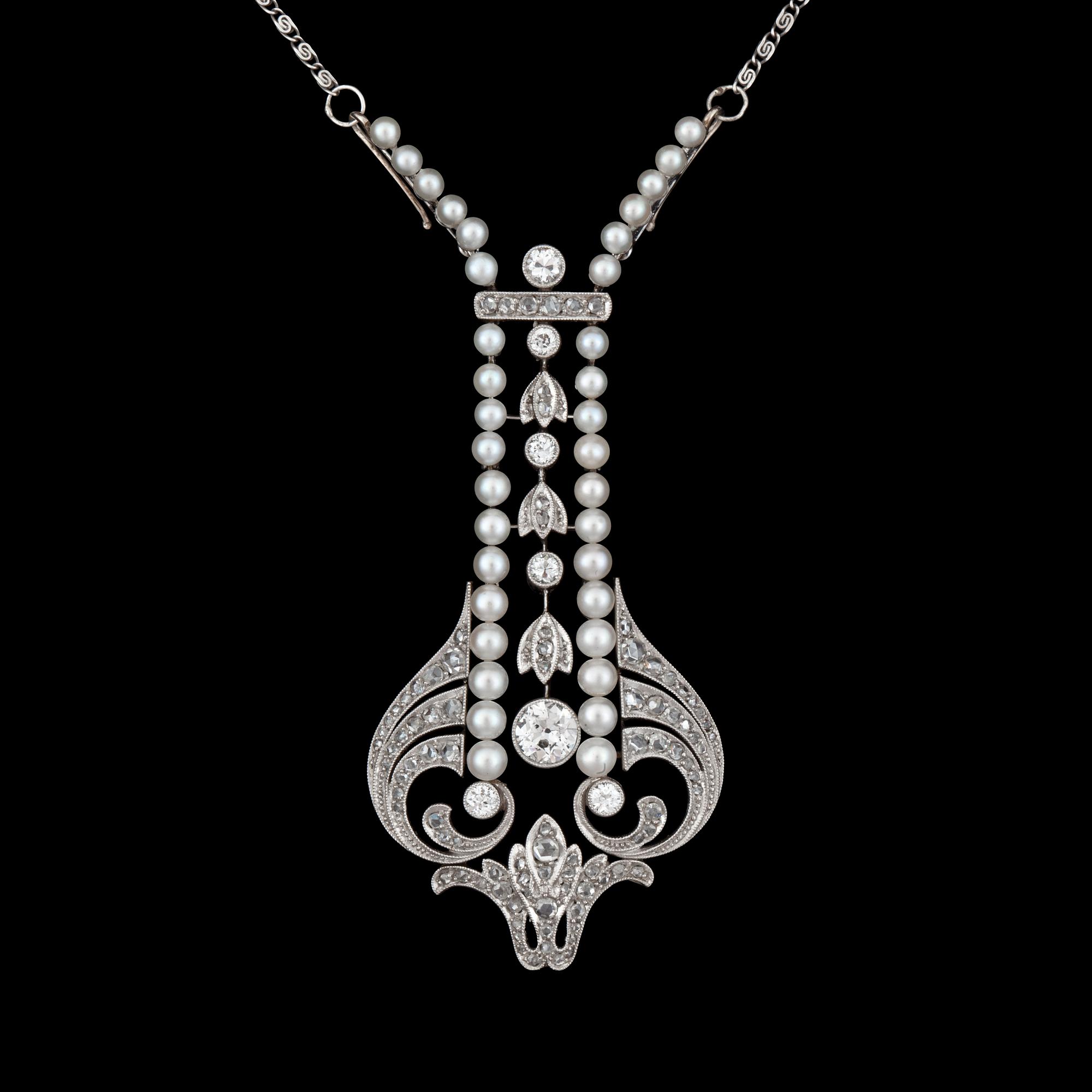 A natural pearl and diamond necklace. Ca 1910.