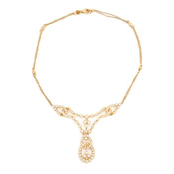 457. An 18K gold necklace set with round brilliant-cut diamonds.