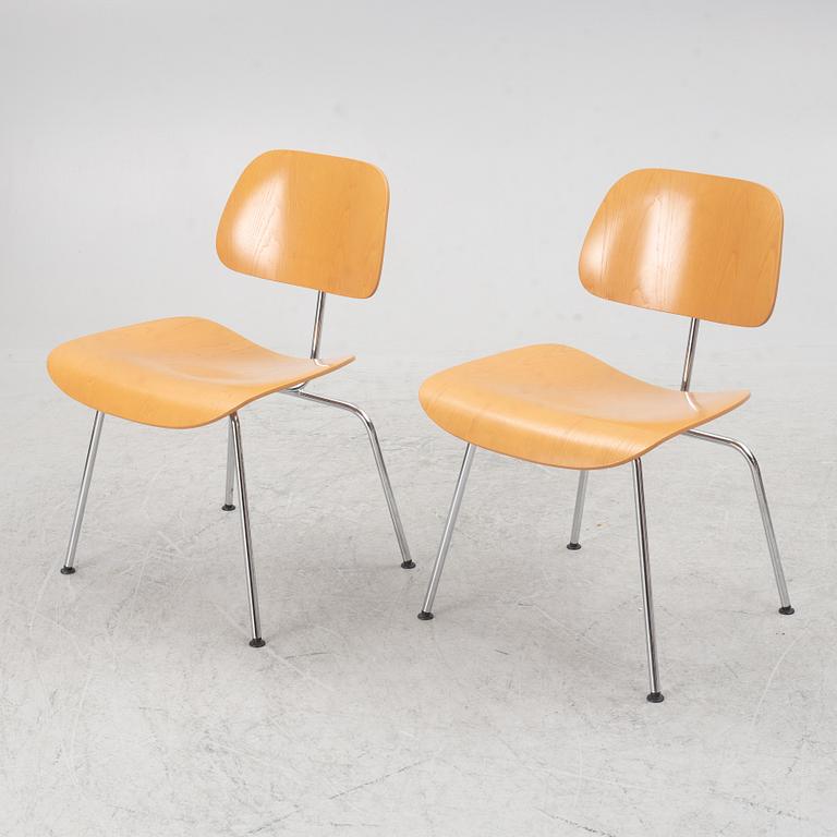 Charles & Ray Eames, a set of four 'DCM' chairs, Vitra, dated 2002.