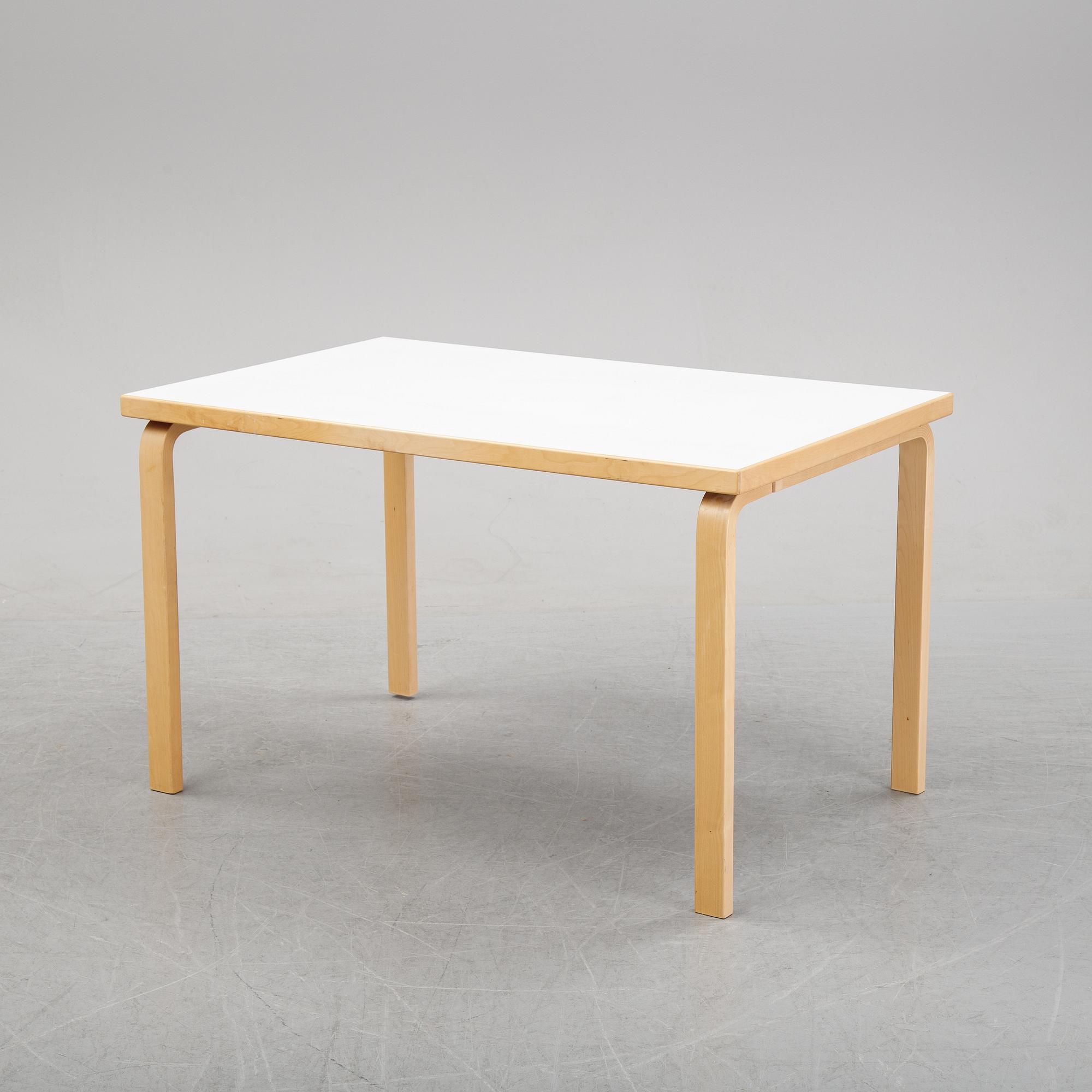 An 'Aalto' table and four chairs model 66 by Alvar Aalto for Artek, designed 1935.