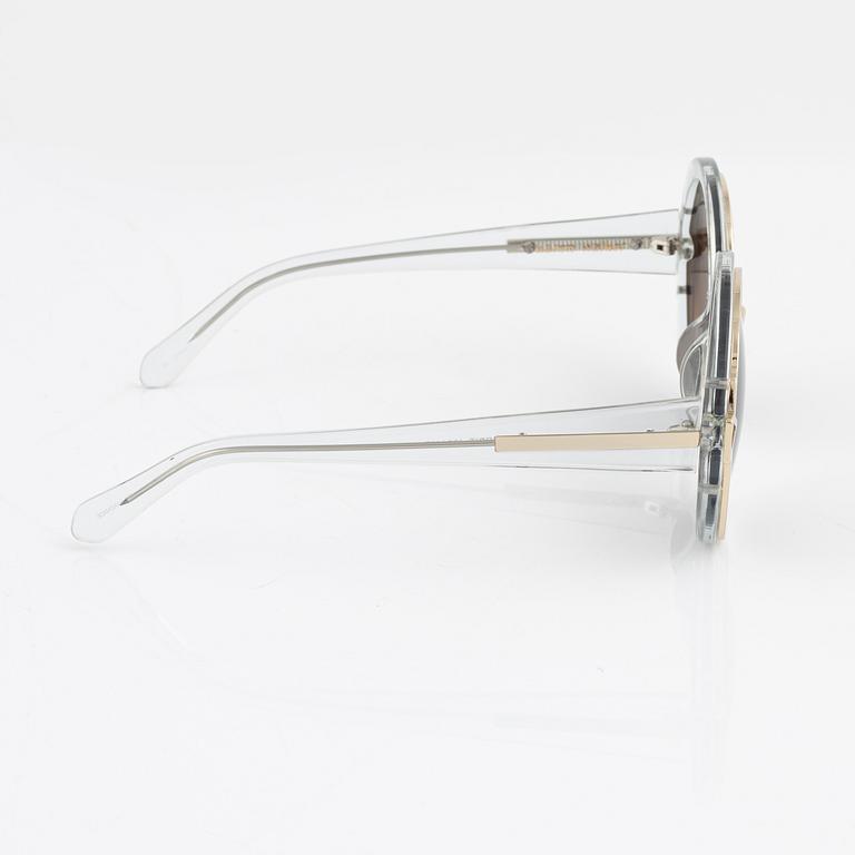 Karen Walker, a pair of "Orbit" sunglasses.