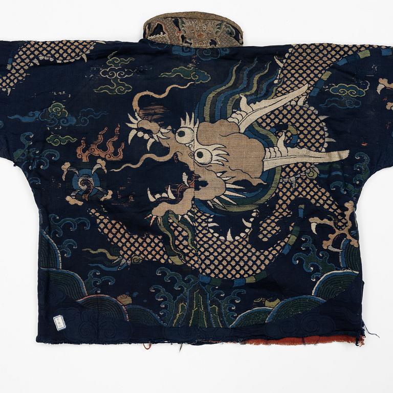 A rare fragment of a silk four clawed 'dragon' jacket, late Ming dynasty/early Qing dynasty.
