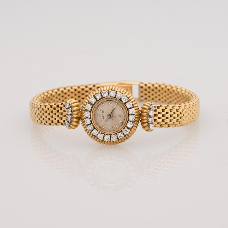 A WRISTWATCH, ladies Cartier, 18K gold, 28 pcs brilliant cut diamonds, totally c. 1,40 ct.