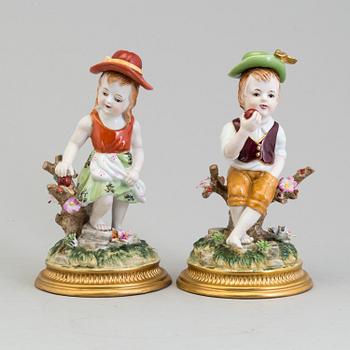 a pair of porcelain figurines marked similar to meissen, 20th century.