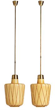 A pair of Swedish Modern vanilla coloured glass ceiling lights with fretted rattan, 1930-40's.