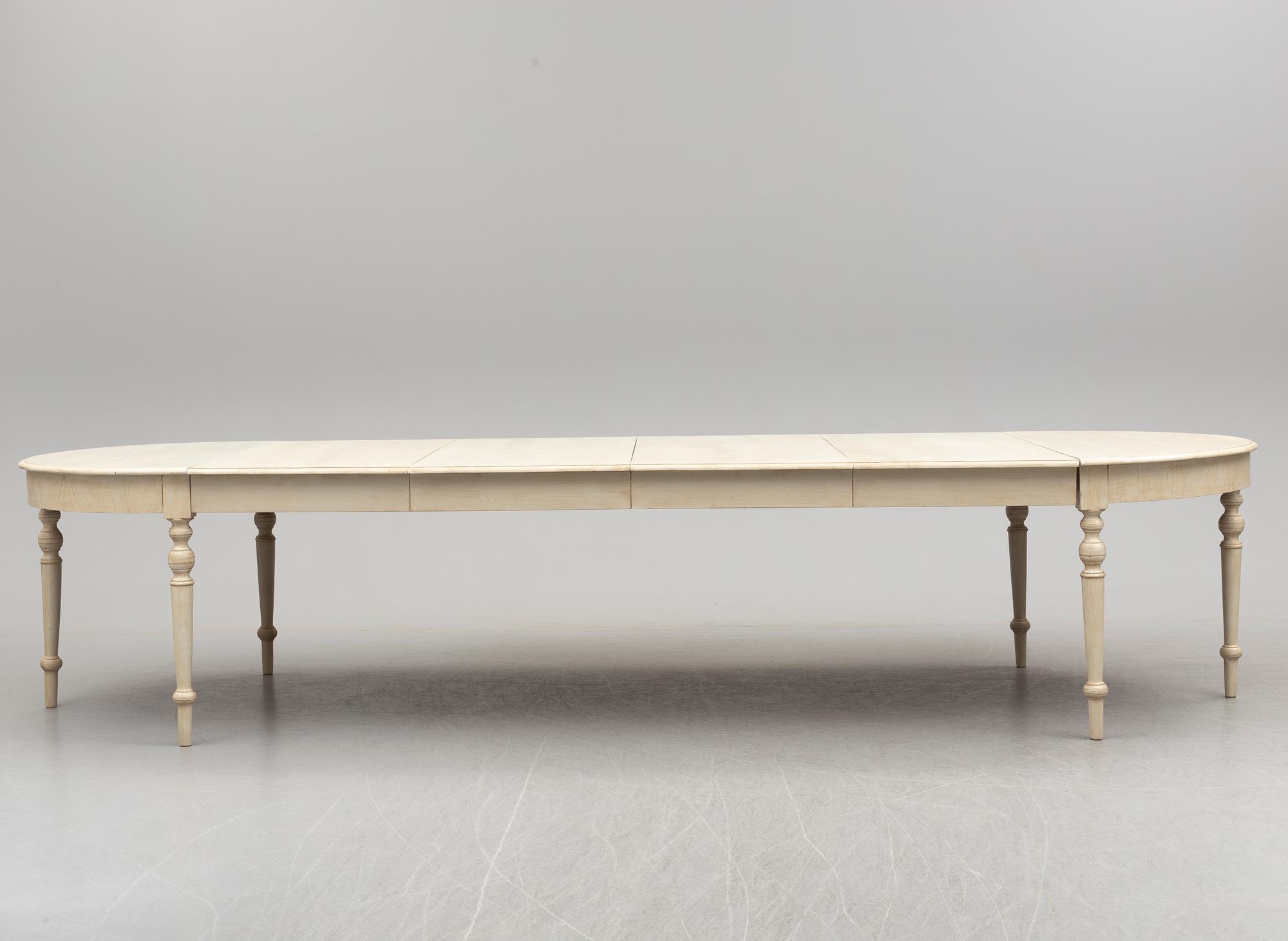 A late 19th century painted dining table.