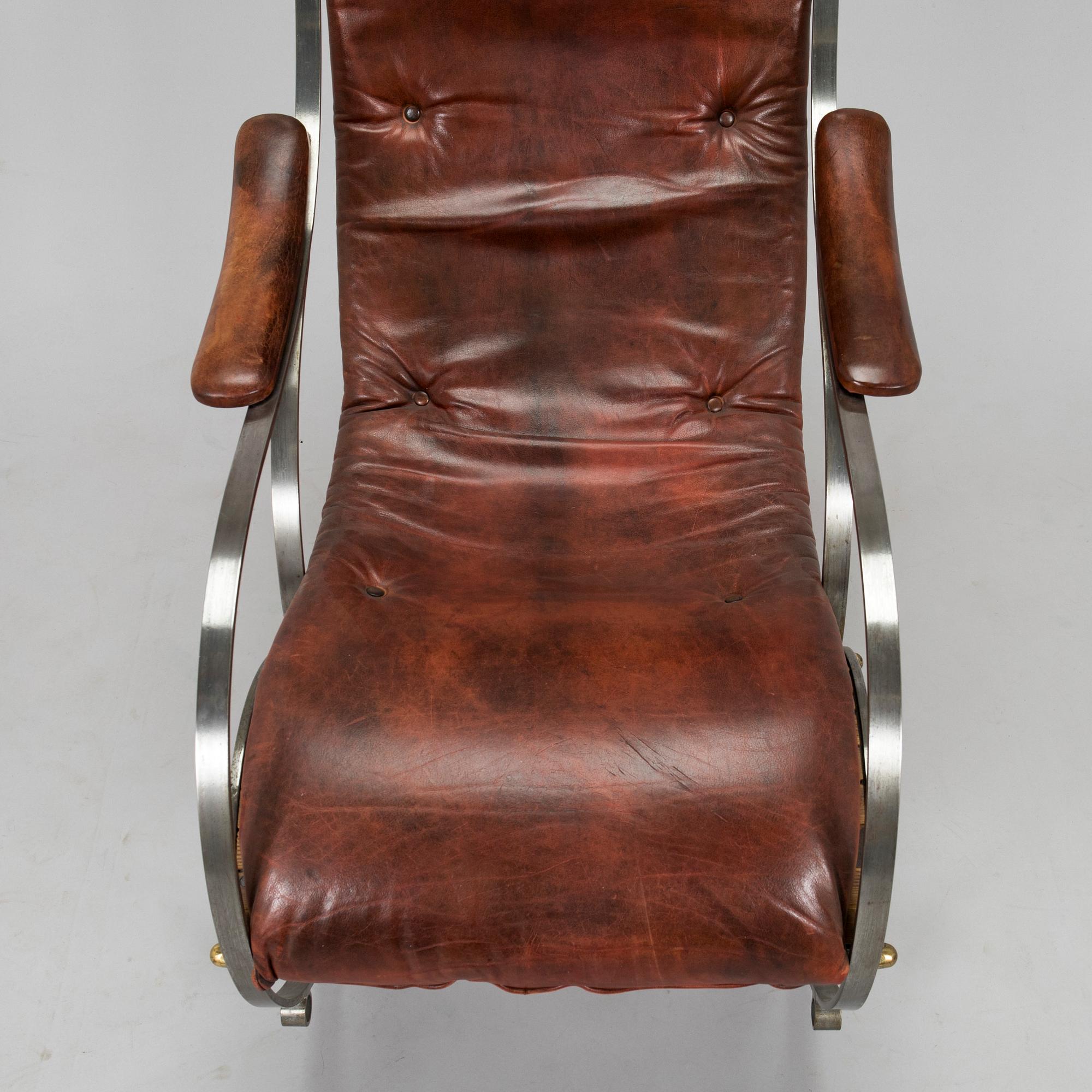 A 20th century steel frame rocking chair.