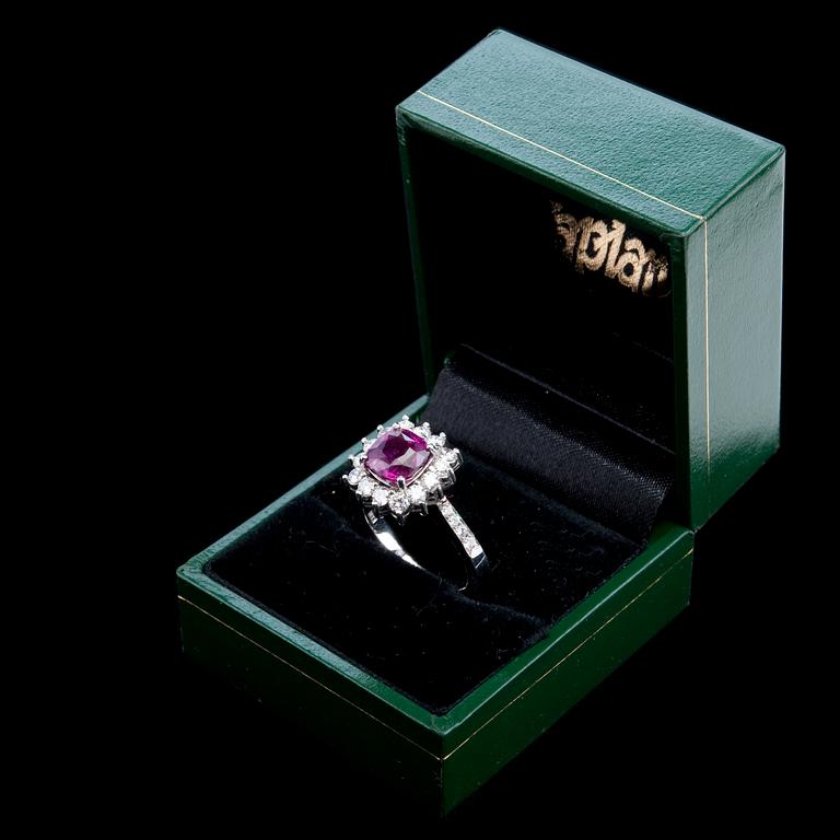 A RING, ruby c. 2.60 ct and diamonds c. 0.86 ct.