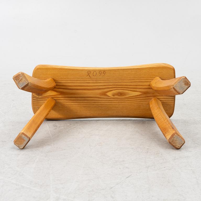 A solid pine stool, signed RO -99, Sweden.