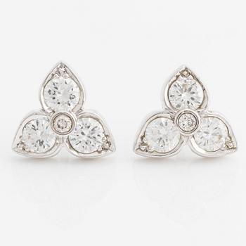 A pair of 18K white gold earrings with round brilliant-cut diamonds.