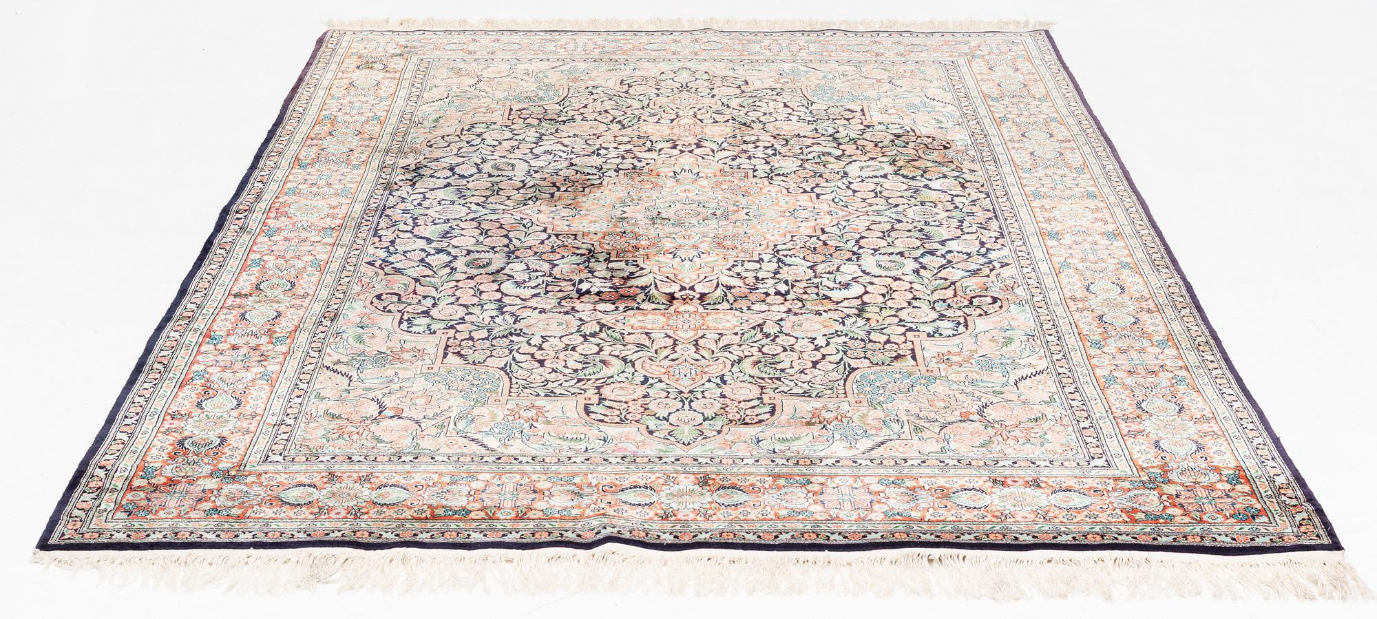 An oriental carpet, mercerized cotton, c. 275 x 182 cm.