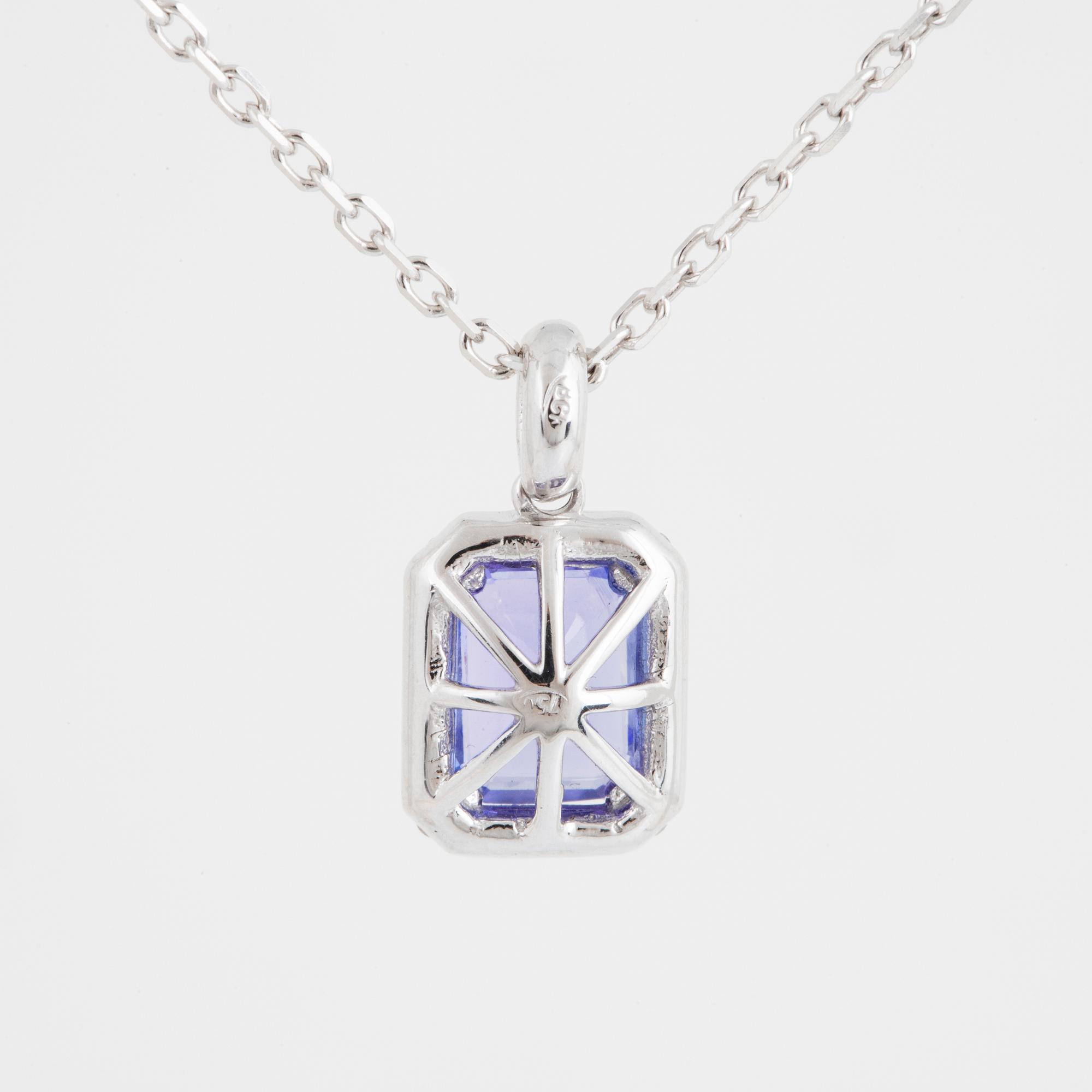 An 18K white gold necklace set with a faceted tanzanite.