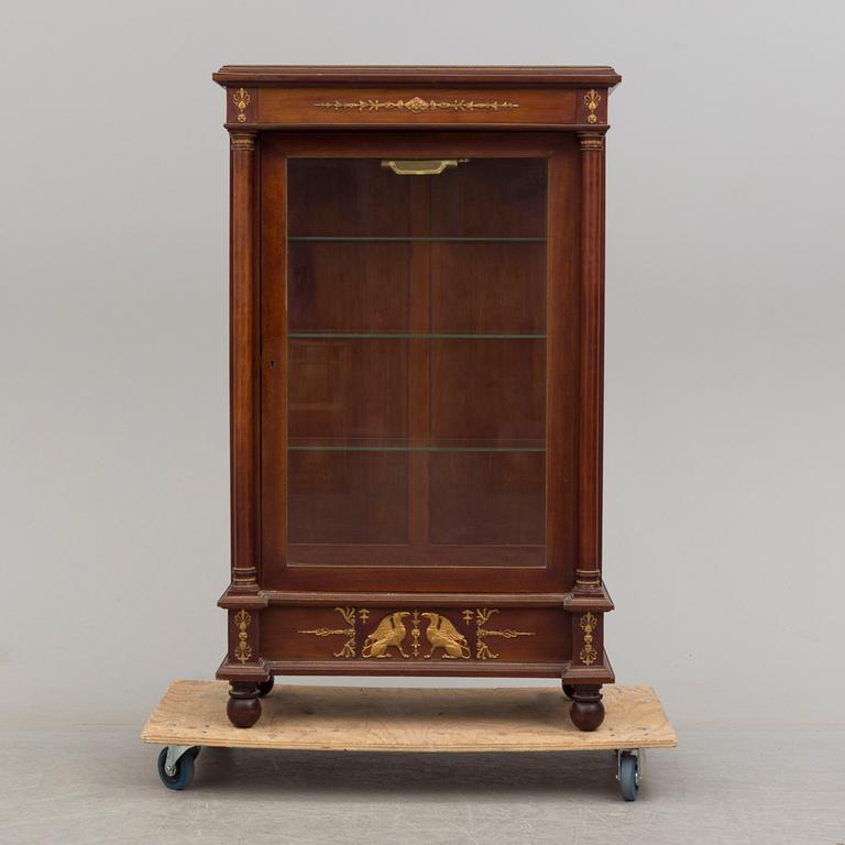 A mahogany veneered Empire style cabinet, circa 1900.