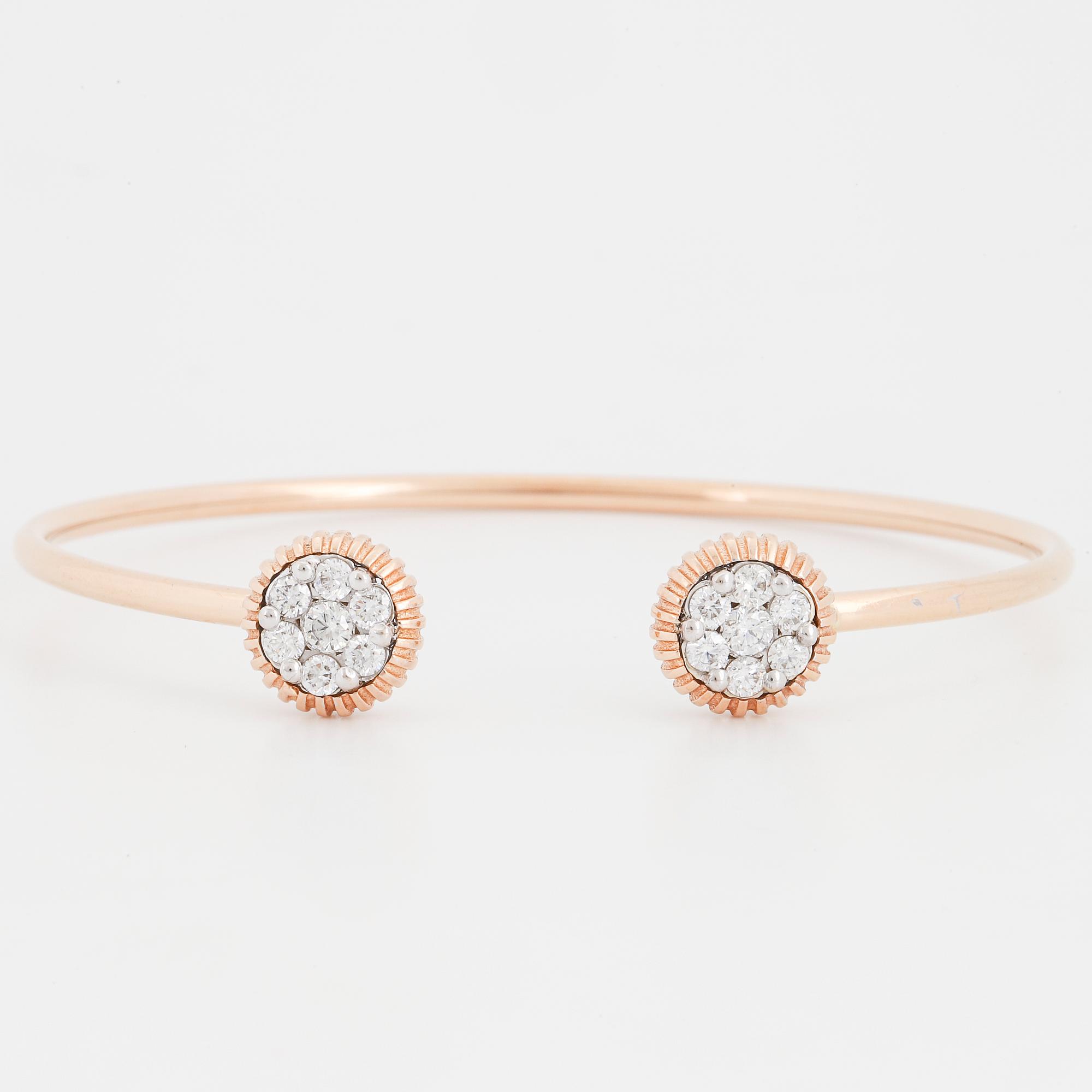 An 18K rose gold bracelet set with round brilliant-cut diamonds.