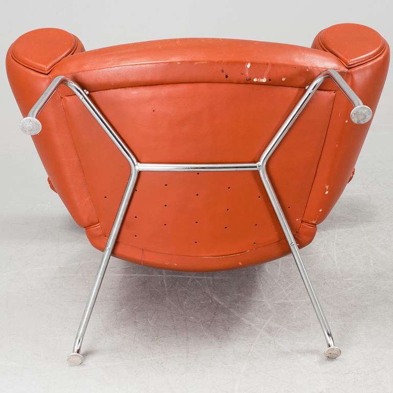 An "Ox-Chair" and foot stool by Hans J Wegner for Erik Jorgensen, Denmark.
