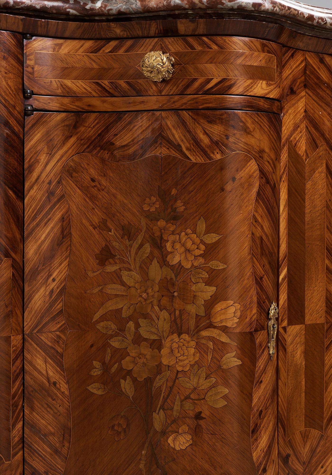 A pair of Louis XV 18th century corner cupboards.