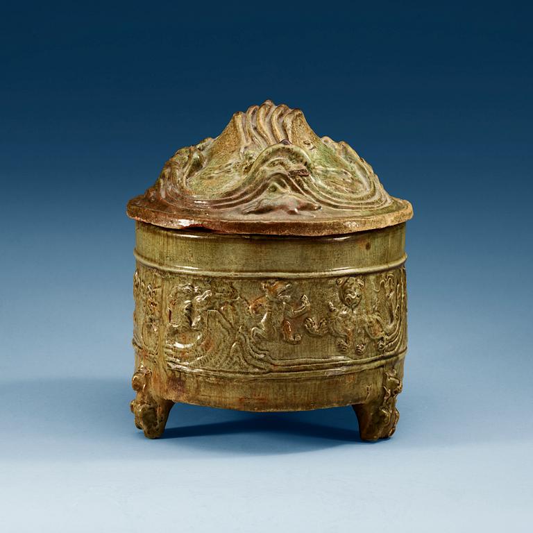 A green glazed tripod censer with cover, Han dynasty (206 BC - 220 AD).