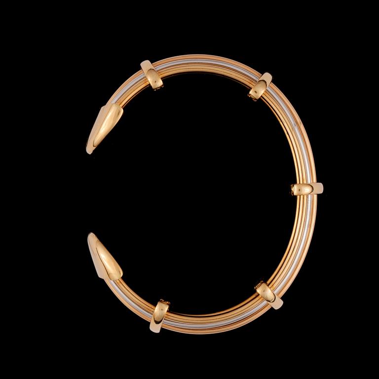 A open model tri-color gold bracelet.