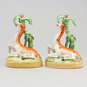 A pair of ceramic figures of giraffes, England, presumably Staffordshire, 19th century.