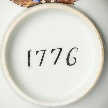 A famille rose armorial cup and stand with the monogram of the Swedish King Gustavus III, Qing dynasty, 18th century.