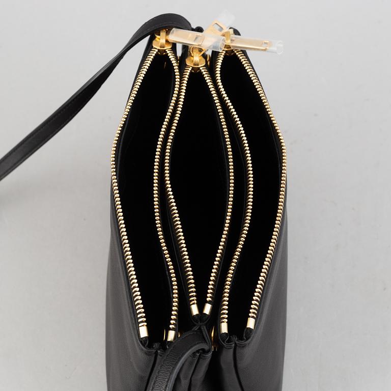 Céline, a black leather 'Trio Bag'.